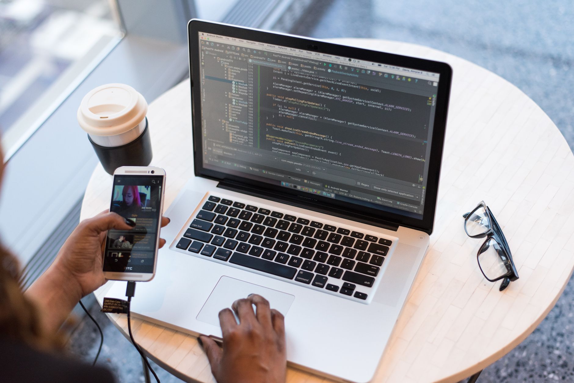 Developer building a Chrome extension Manifest V3 project on a laptop at a desk