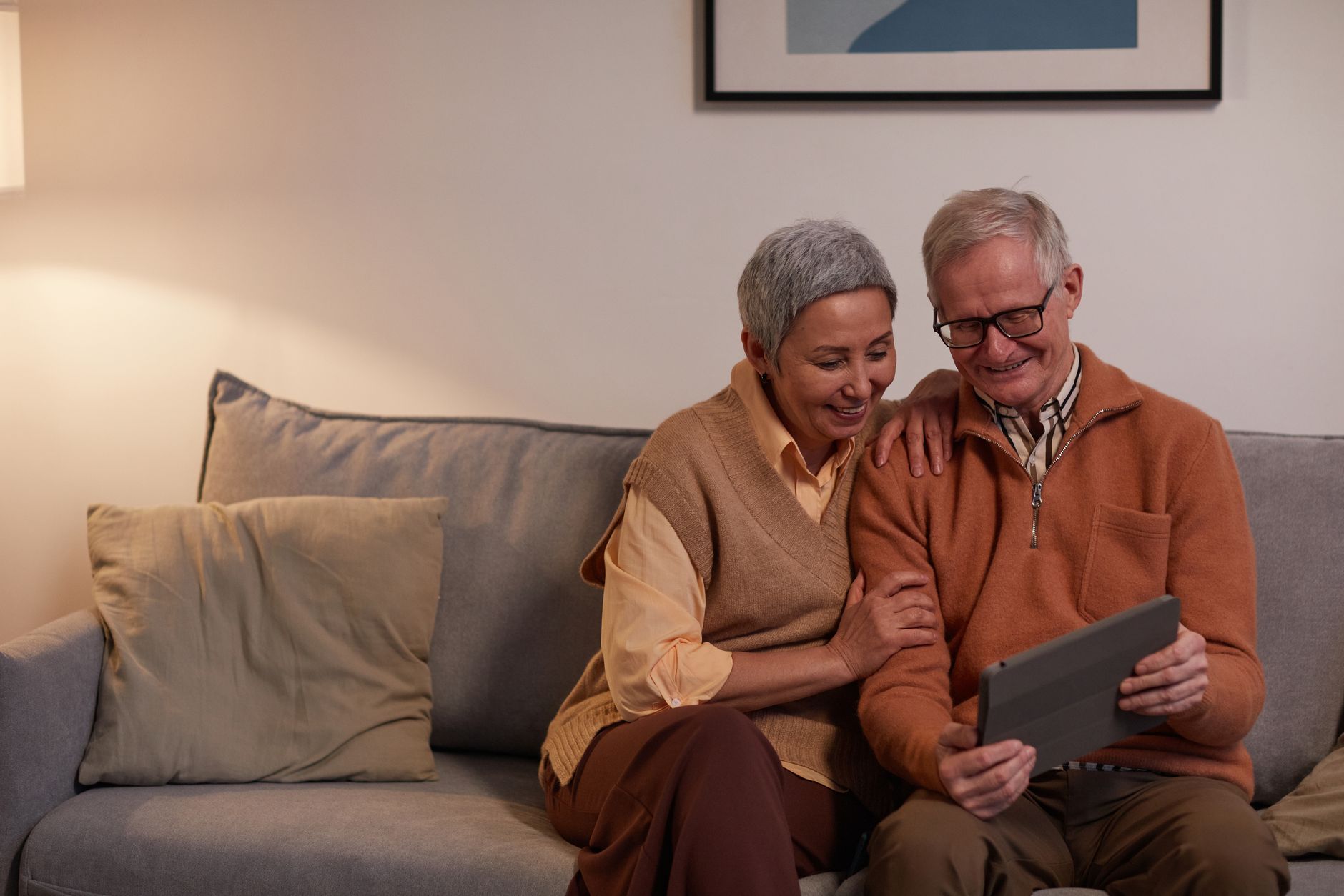 Older woman using a tablet at home, relevant to designing for older users UK accessibility