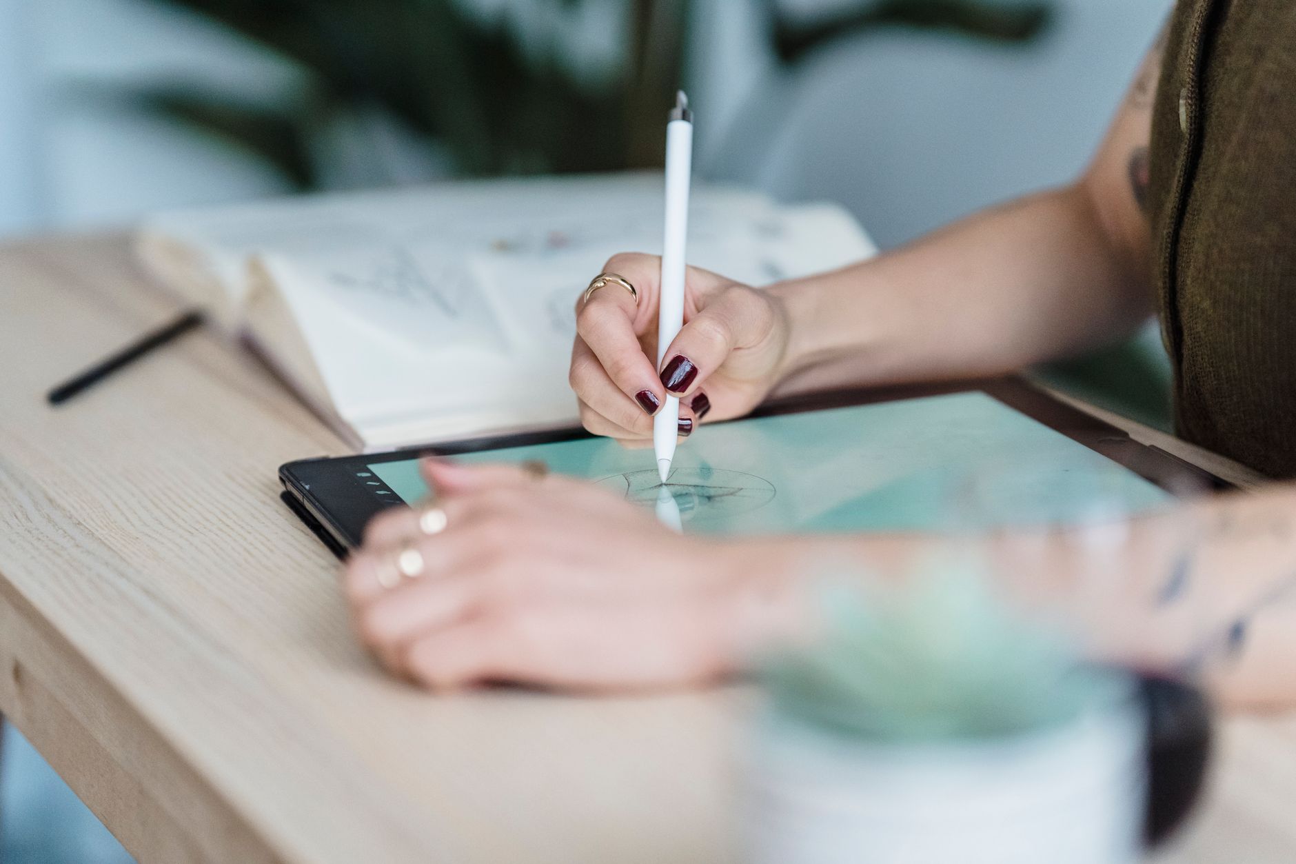 Designer working on pixel art indie game design at a graphics tablet