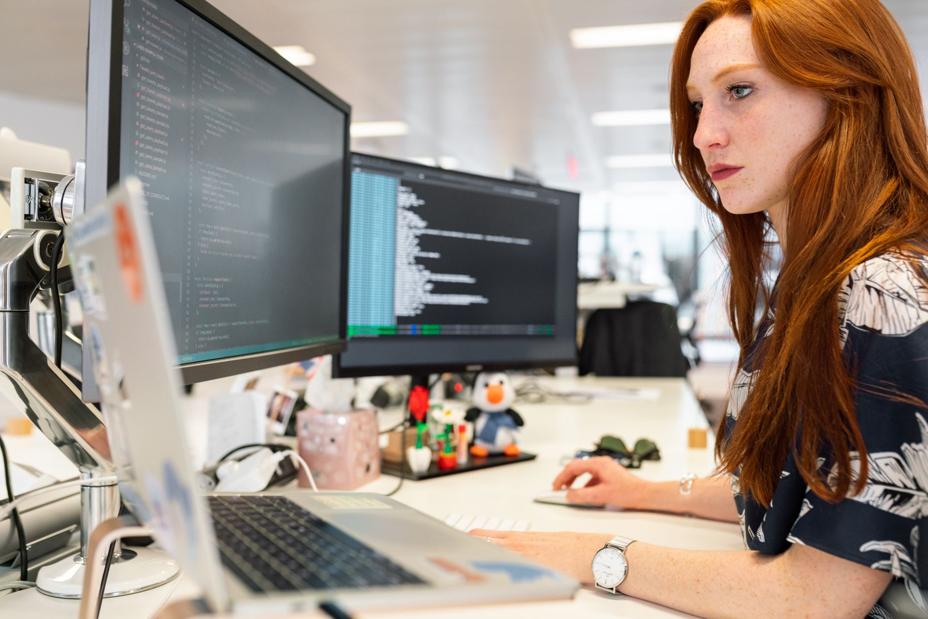 Frontend developer analysing UK Core Web Vitals data on performance dashboard monitors